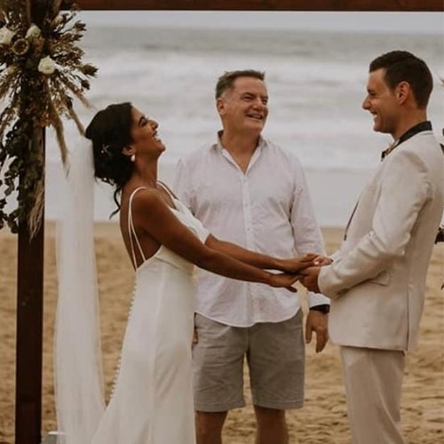 Gavin Brown officiating an outdoor wedding ceremony